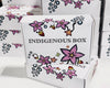 White boxes with floral designs and 'Indigenous Box' text on a white background
