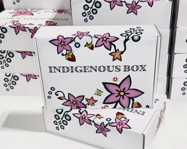 White boxes with floral designs and 'Indigenous Box' text on a white background