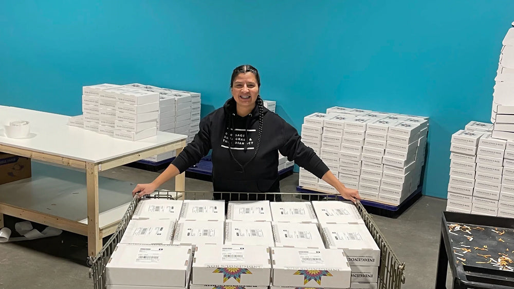 Founder Mallory Yawnghwe with Indigenous Box orders packed and ready to ship